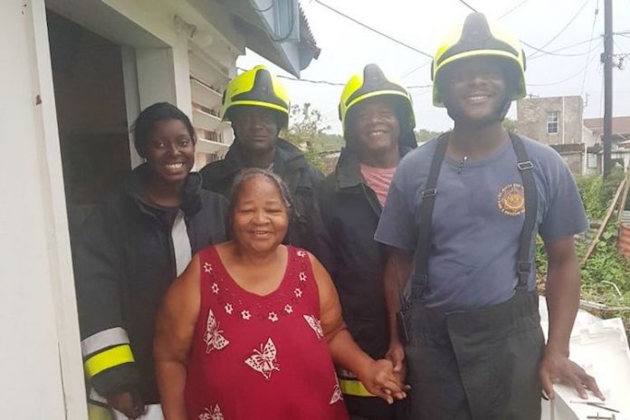 FIRE AND RESCUE SERVICES LENDS HELPING HAND TO HURRICANE-AFFECTED SENIOR CITIZEN 1
