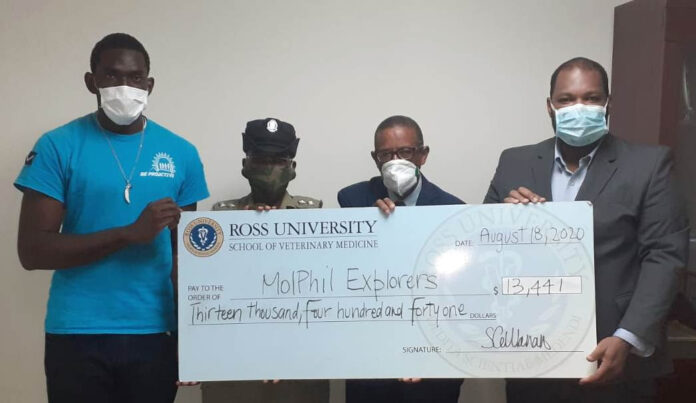Ross University donates over $13,000 to explorers club to support youth Ross University donates over $13,000 to explorers club to support youth