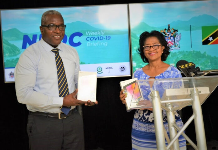 DR. CAMERON WILKINSON AND DR. HAZEL LAWS SPORTING THE NEW TABLETS