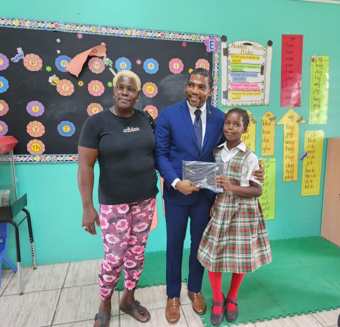 PM Drew and Minister Geoffrey Hanley fulfil promise Of donating laptops,image: facebook PM Drew and Minister Geoffrey Hanley fulfil promise Of donating laptops,image: facebook