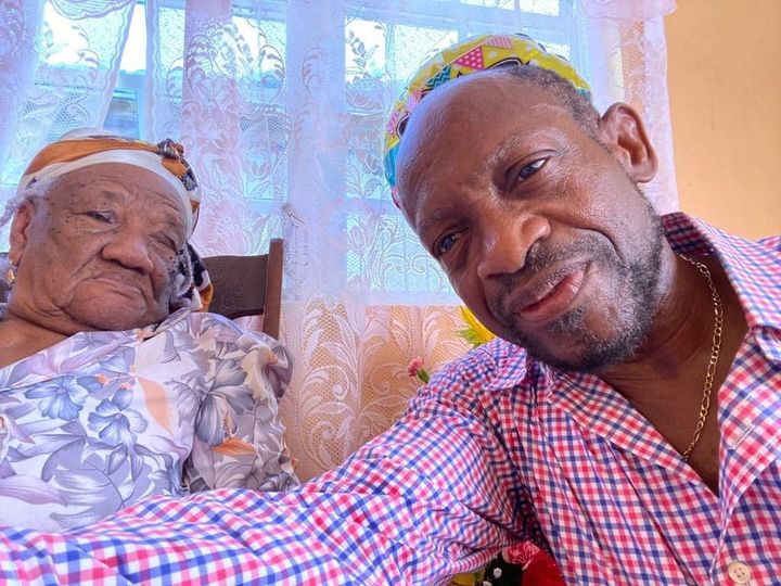 Minister Denzil Douglas with Ivy Battice. Picture Credits: Fb accounts