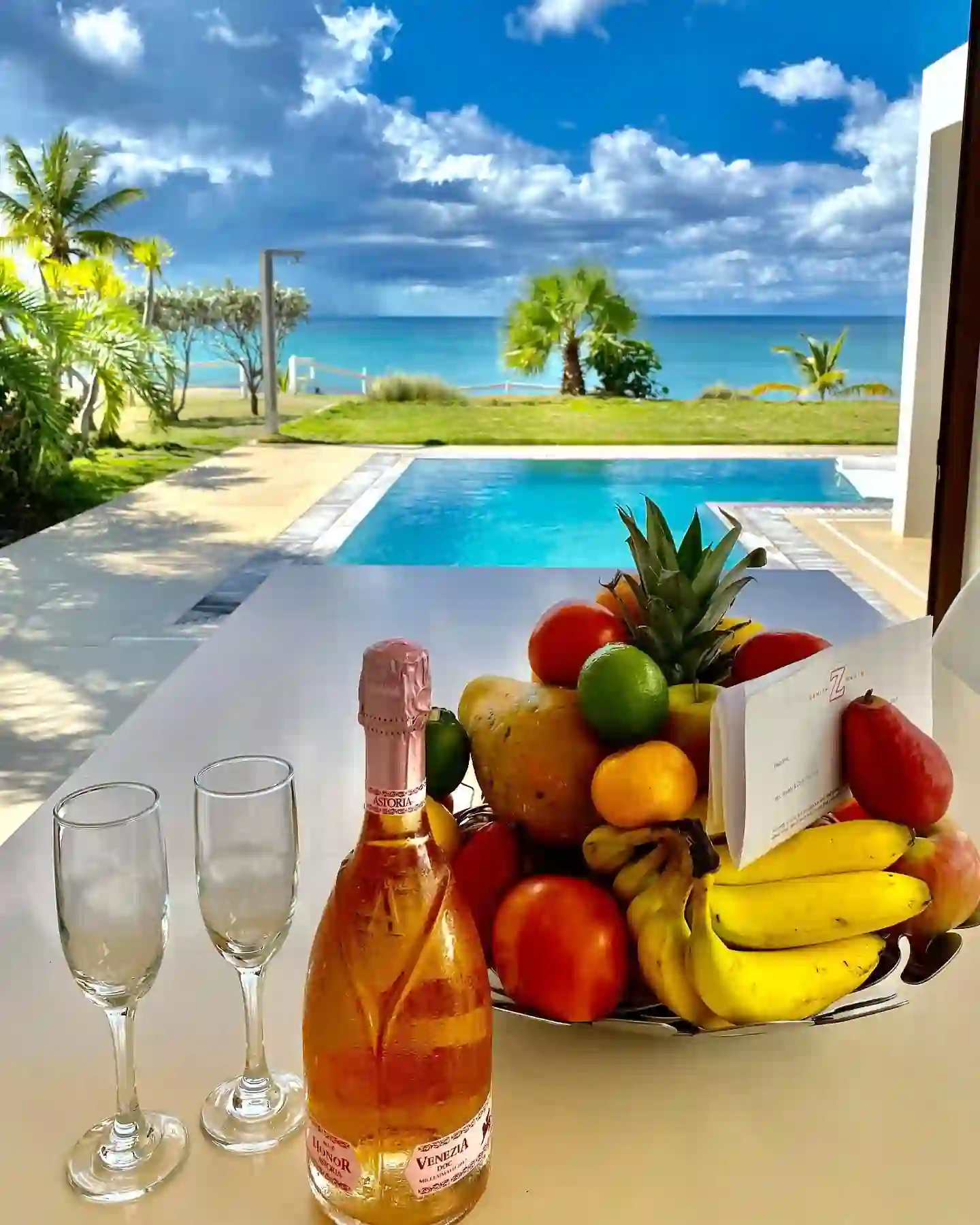 Poolside comfort with a stunning beach view. (Credits: Nevis Tourism Authority, Facebook)