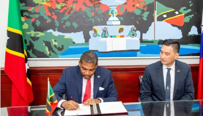 PM Drew signed agreement with OECC President Hsiao Yun Yeh. (Credits: St.Kitts and Nevis Information Service - SKNIS, Facebook)