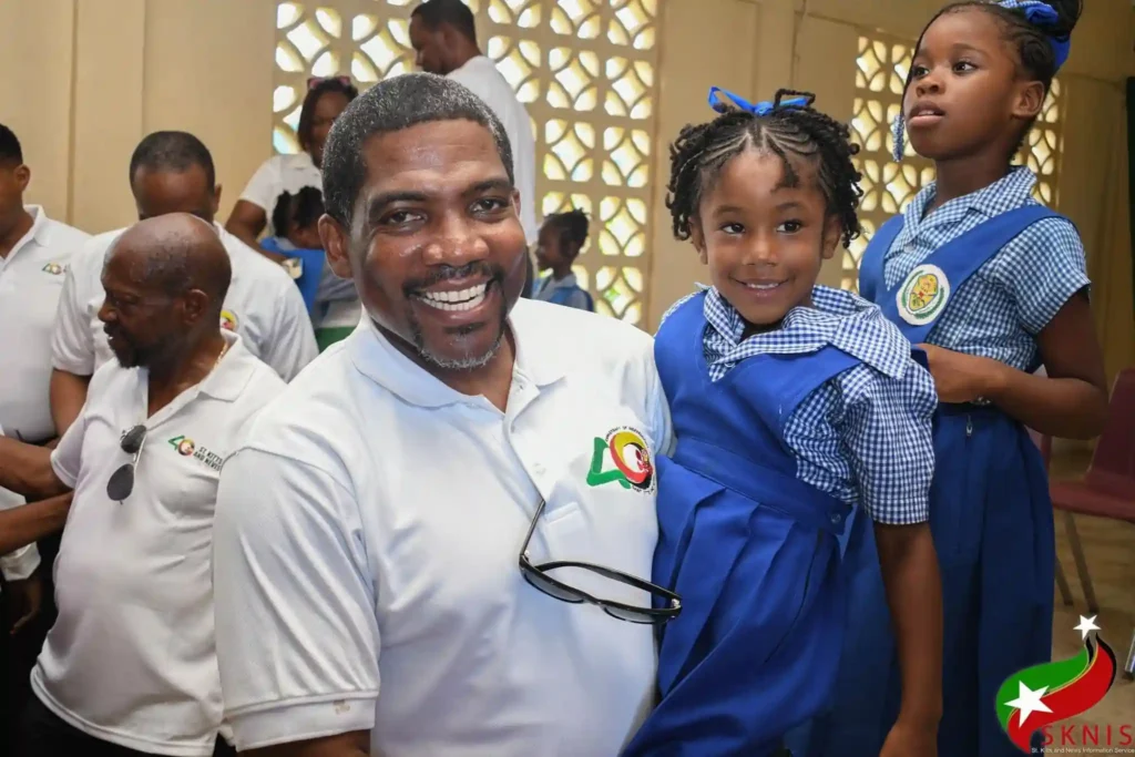 PM Terrance Drew engaging with children. Credits: Facebook, Dr. Terrance Drew.