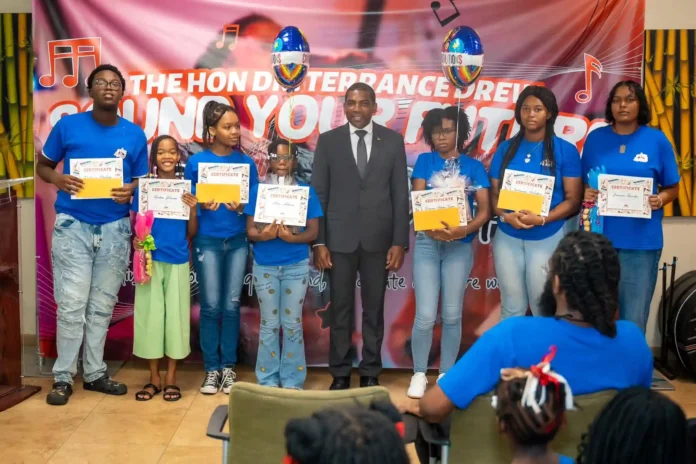 PM Terrance Drew congratulates the participants of ‘Sound Your Future’ Summer Camp. Credits: Facebook.