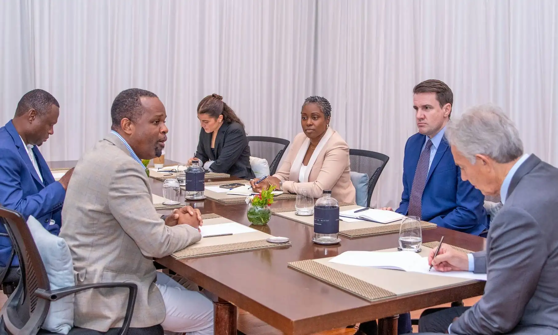 Minister Konris Maynard and team in a meeting with Tony Blair