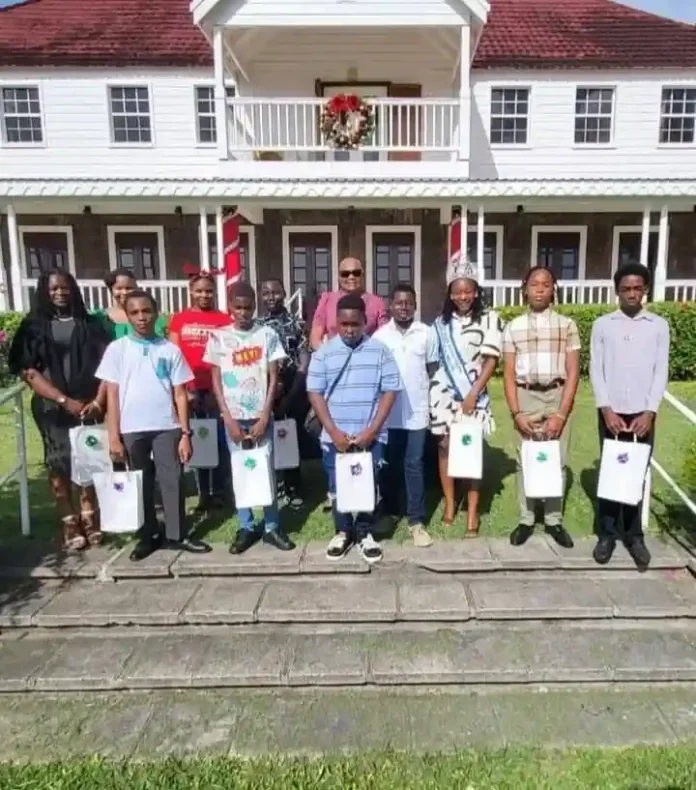 Governor General Dame Marcella Liburd distributes tablets to children